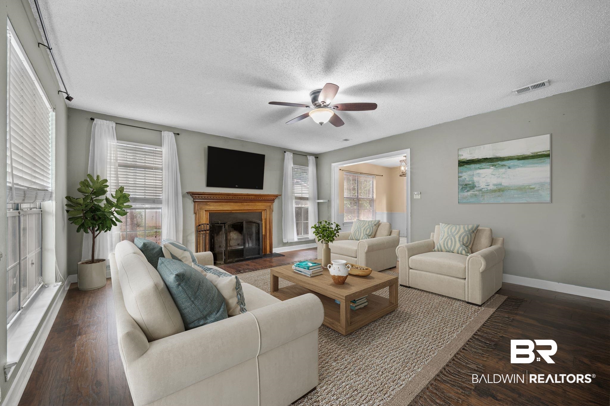 100 Montclair Loop Daphne, AL 36526 - Photo 38 of 39 Living room with a textured ceiling, dark wood-type flooring, and ceiling fan