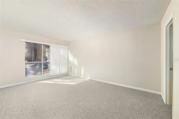 a view of walk in closet with clothes
