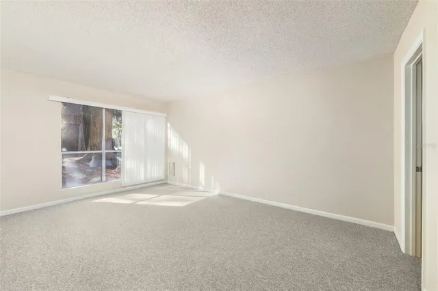 a view of walk in closet with clothes