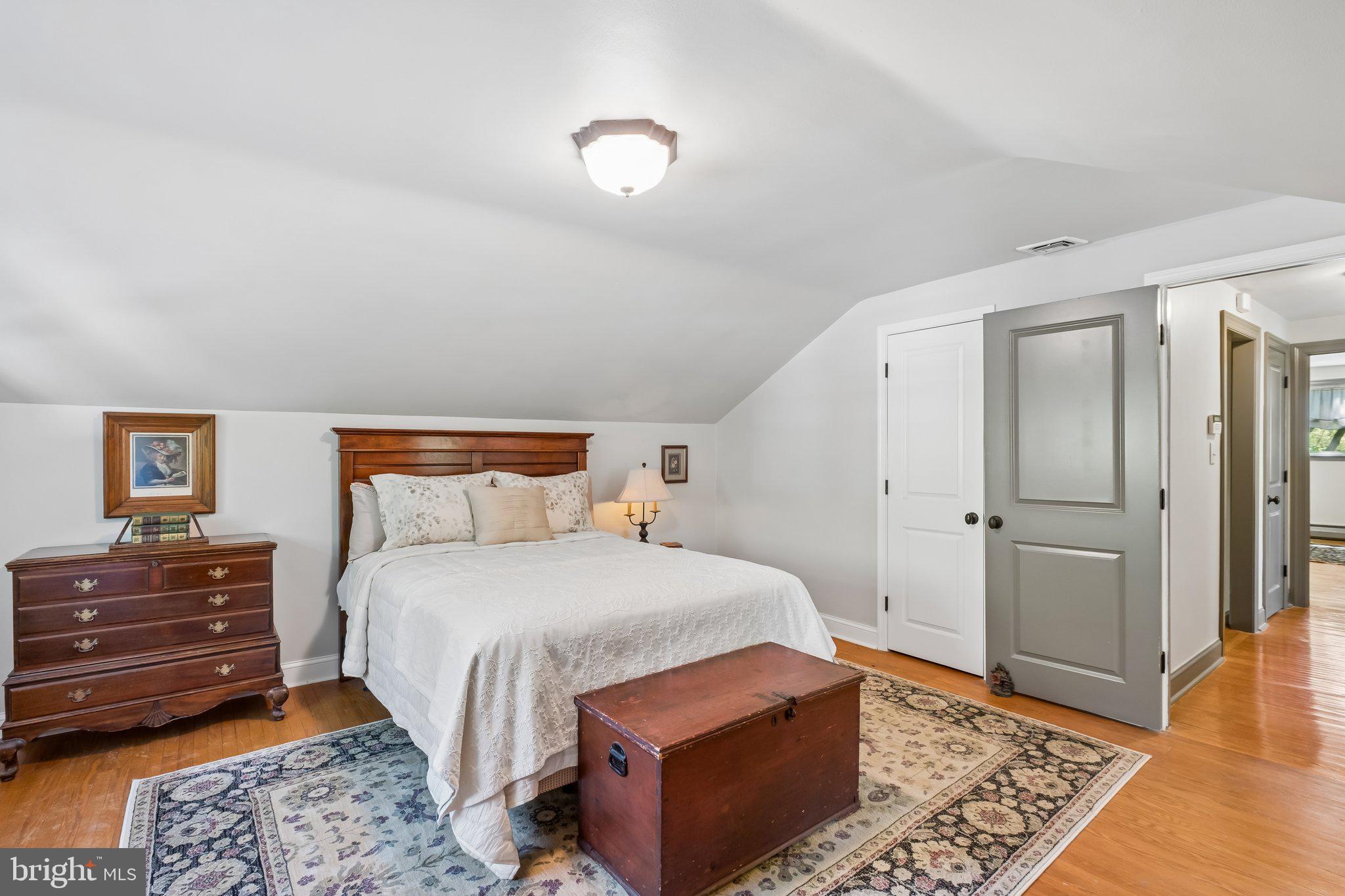 713 Alene Road Ambler, PA 19002 - Photo 24 of 40 a bedroom with a bed and wooden floor