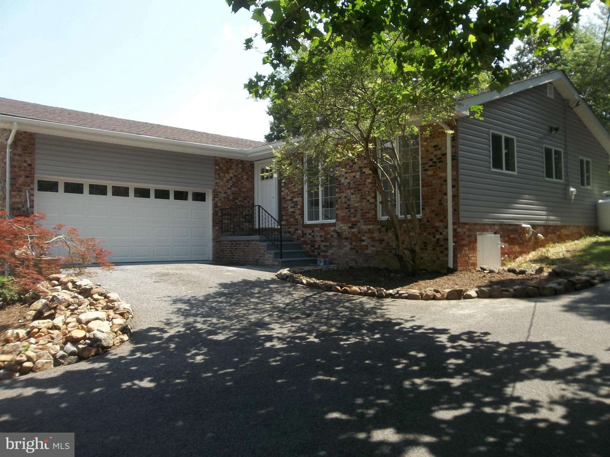 6038 Howellsville Road Front Royal, VA 22630 - Photo 1 of 30 a front view of a house with a yard