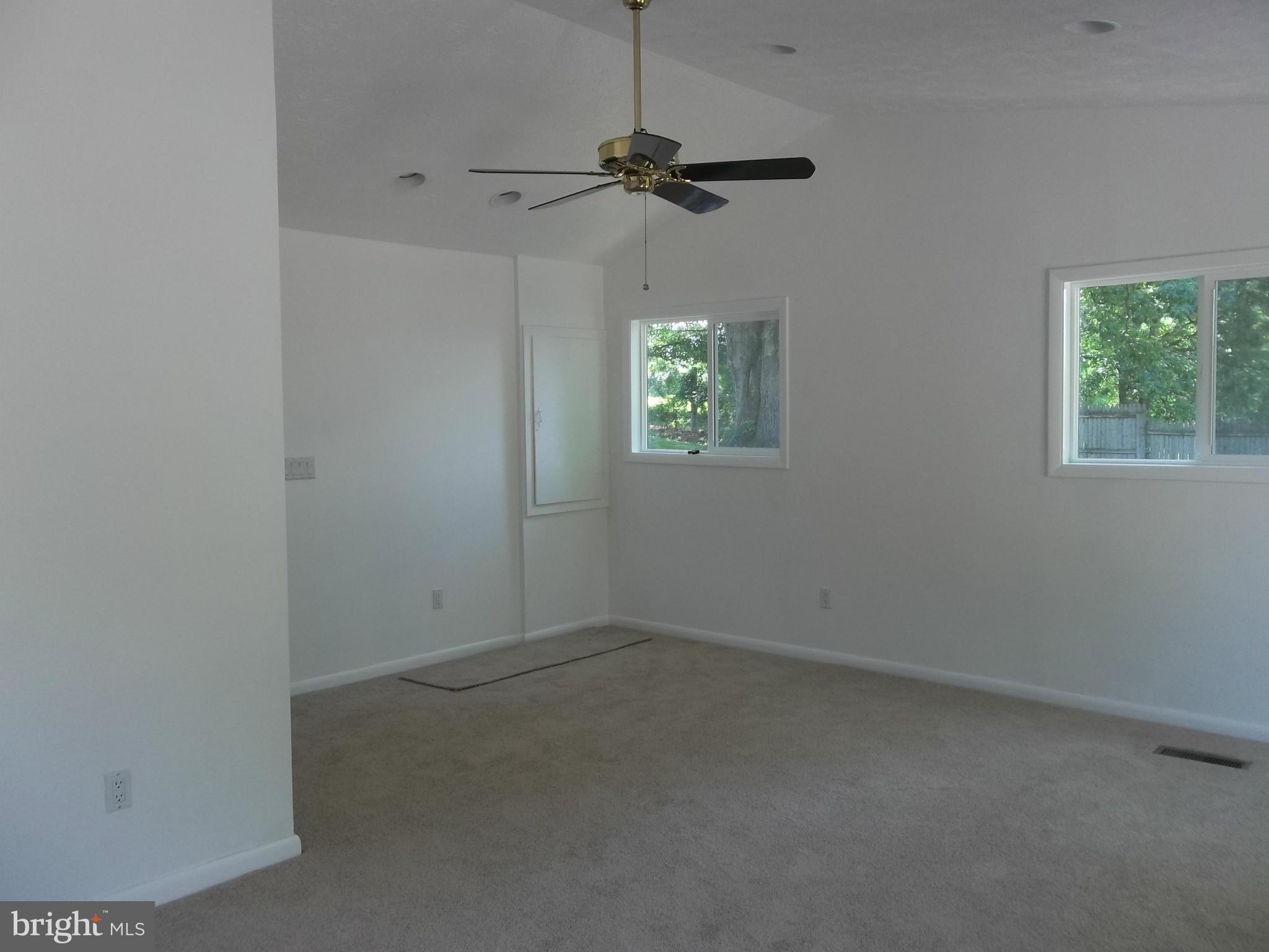 6038 Howellsville Road Front Royal, VA 22630 - Photo 13 of 30 an empty room with windows and fan