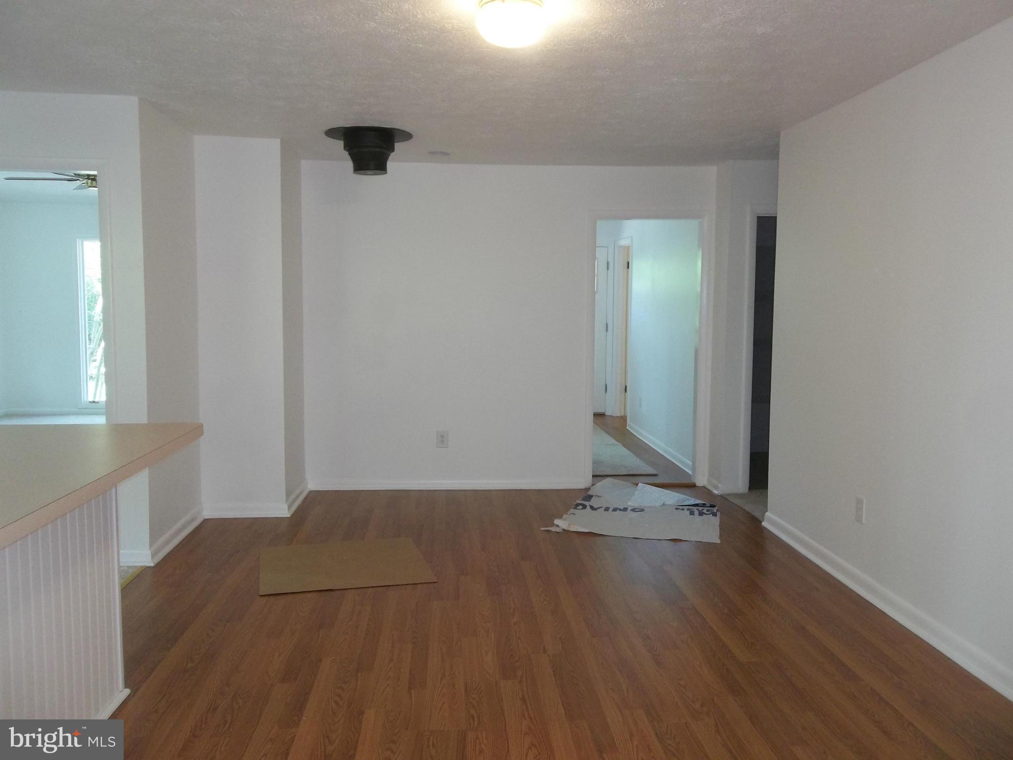 6038 Howellsville Road Front Royal, VA 22630 - Photo 15 of 30 an empty room with wooden floor and windows
