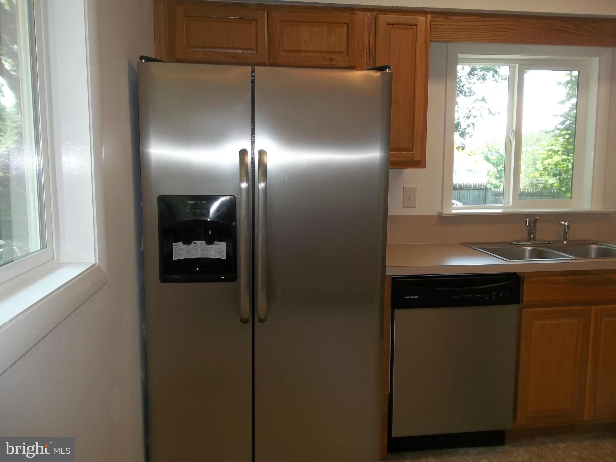 6038 Howellsville Road Front Royal, VA 22630 - Photo 19 of 30 a kitchen with a refrigerator and a sink