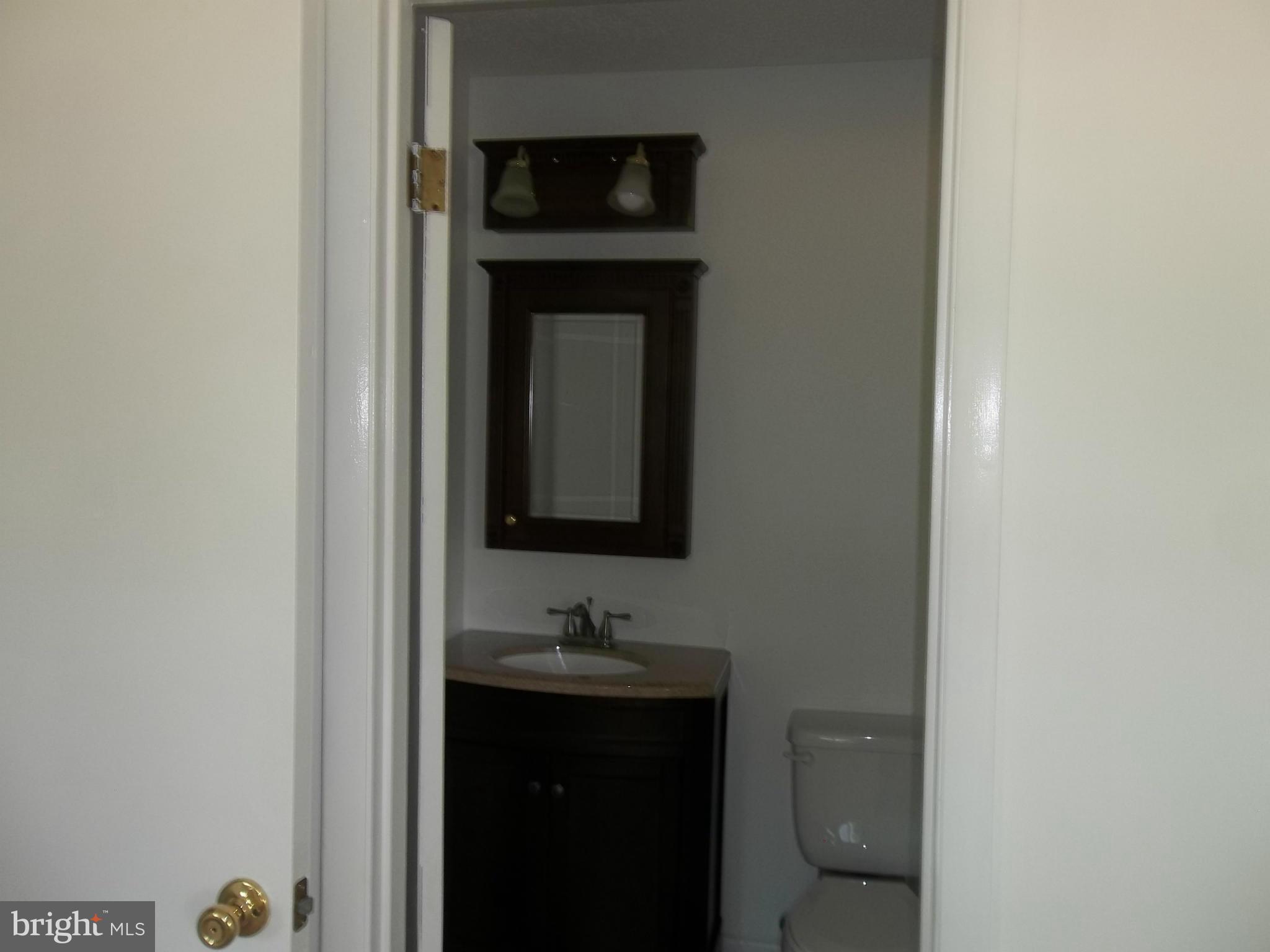 6038 Howellsville Road Front Royal, VA 22630 - Photo 23 of 30 a bathroom with a sink and a toilet