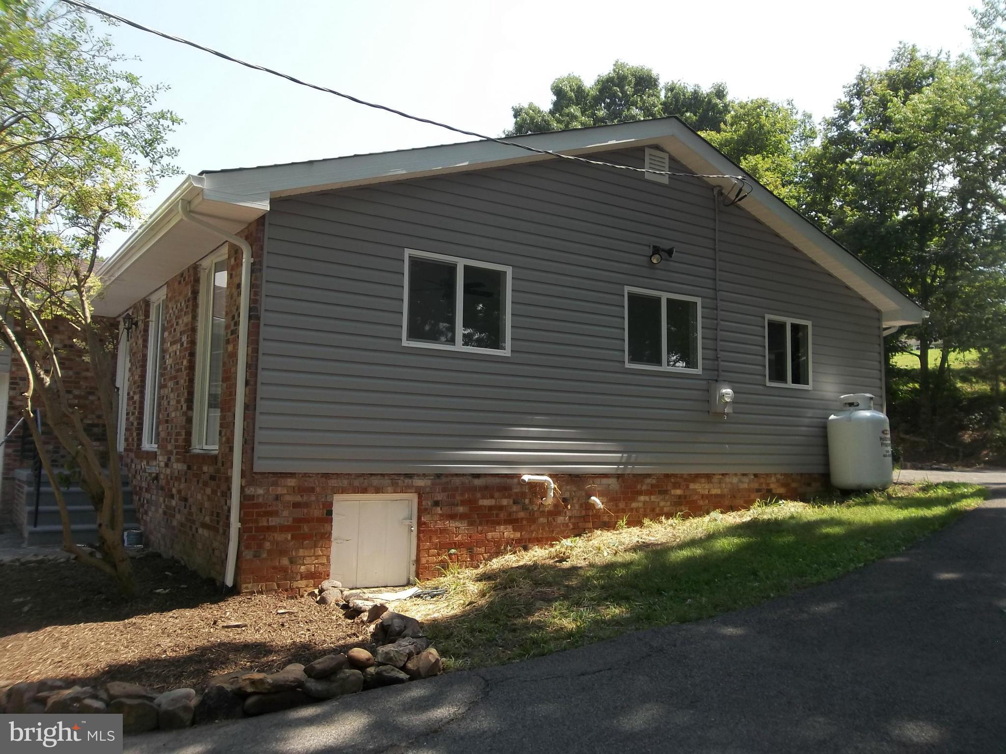 6038 Howellsville Road Front Royal, VA 22630 - Photo 6 of 30 a view of a small house with yard