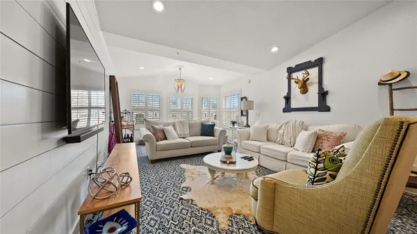 a living room with furniture and a couch