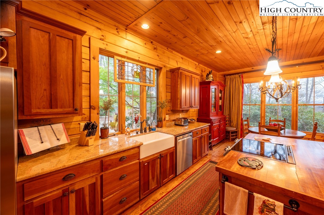 725 Fox Den Road Blowing Rock, NC 28605 - Photo 14 of 44 a kitchen with a large window and a sink