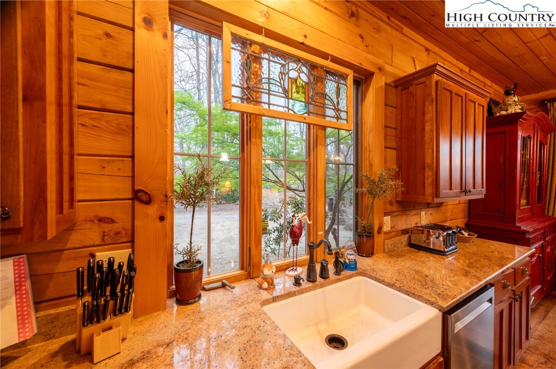 725 Fox Den Road Blowing Rock, NC 28605 - Photo 15 of 44 a view of a bathroom with a tub and a sink