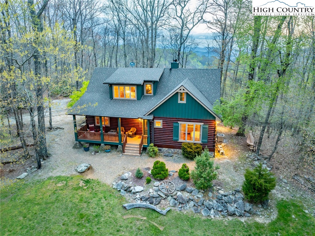 725 Fox Den Road Blowing Rock, NC 28605 - Photo 2 of 44 a front view of a house with garden