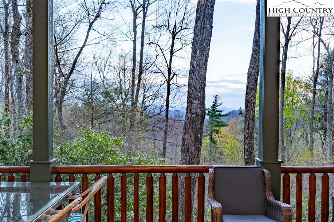 725 Fox Den Road Blowing Rock, NC 28605 - Photo 27 of 44 a view of a balcony with wooden fence