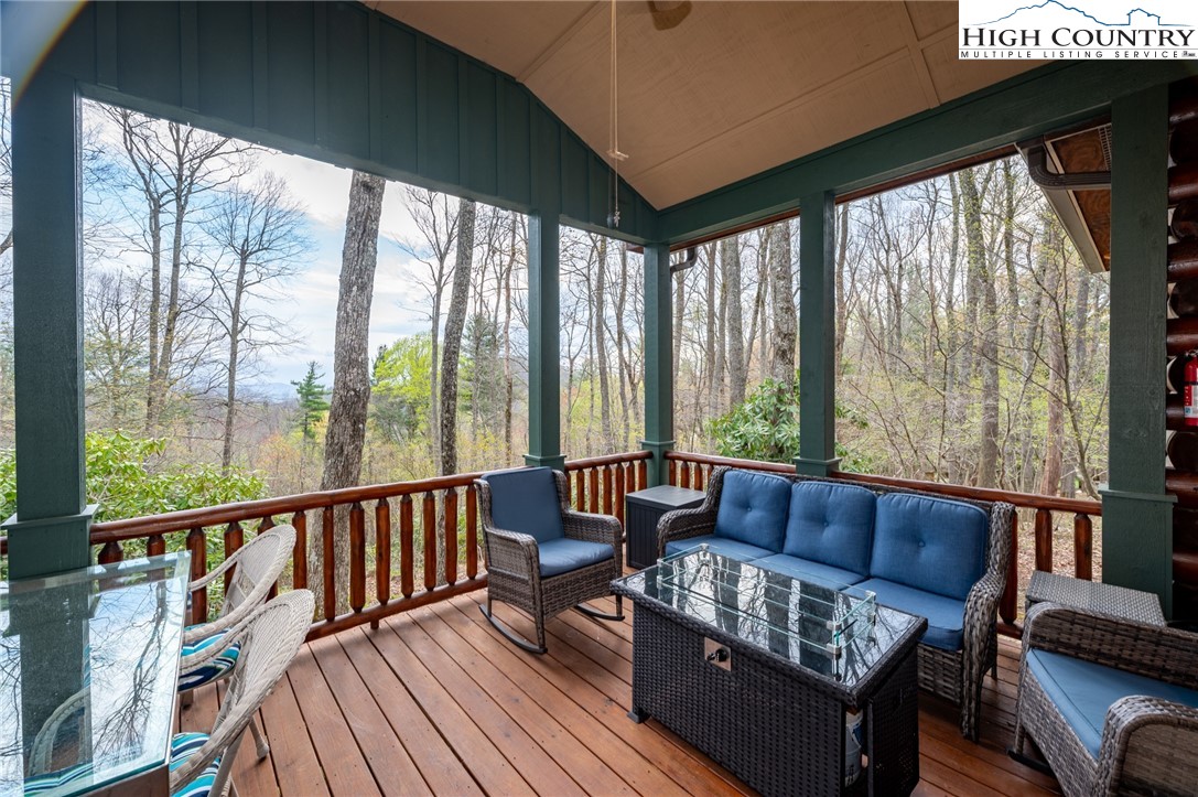 725 Fox Den Road Blowing Rock, NC 28605 - Photo 28 of 44 a living room with furniture and floor to ceiling windows