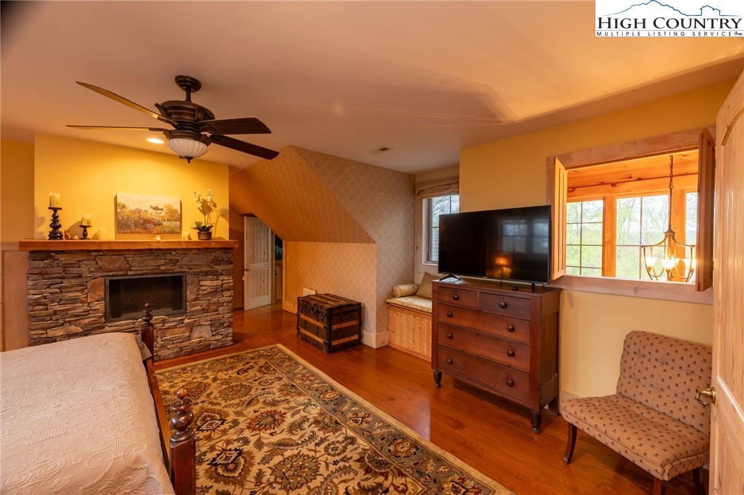 725 Fox Den Road Blowing Rock, NC 28605 - Photo 33 of 44 a living room with furniture and a flat screen tv