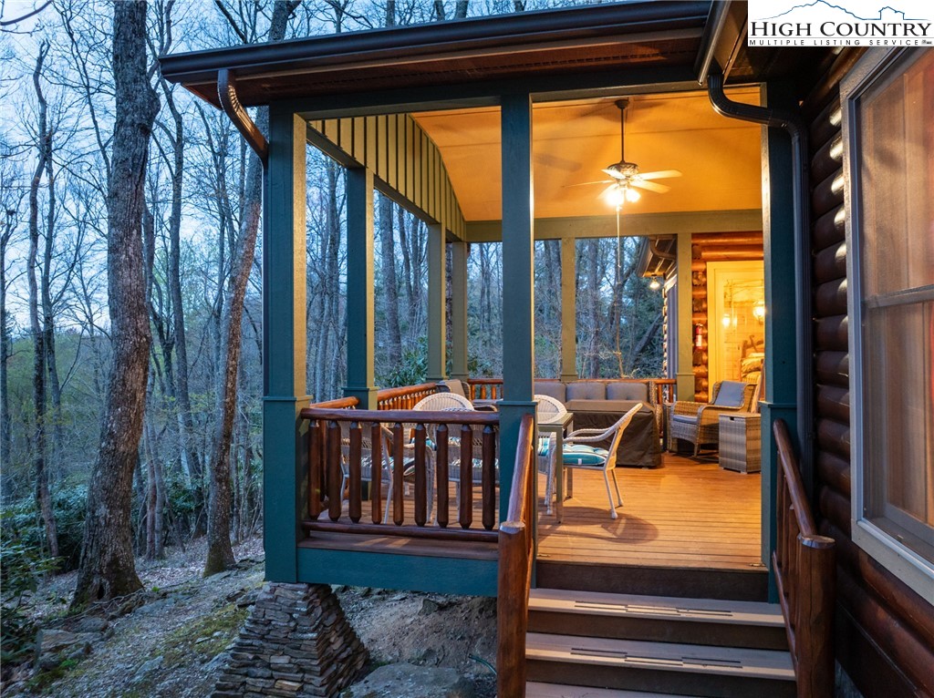 725 Fox Den Road Blowing Rock, NC 28605 - Photo 39 of 44 a view of a patio with a table chairs and a yard