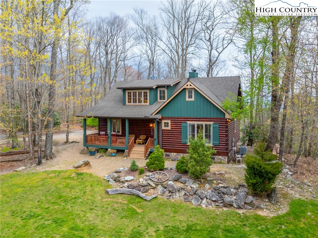 725 Fox Den Road Blowing Rock, NC 28605 - Photo 4 of 44 a front view of a house with garden