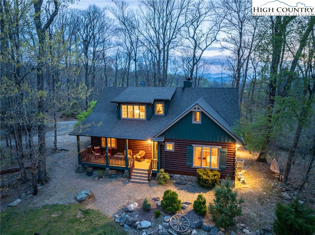 725 Fox Den Road Blowing Rock, NC 28605 - Photo 44 of 44 a view of a house with a yard patio and fire pit