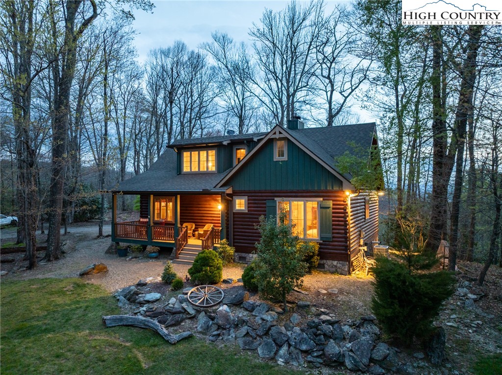 725 Fox Den Road Blowing Rock, NC 28605 - Photo 6 of 44 a front view of a house with a yard