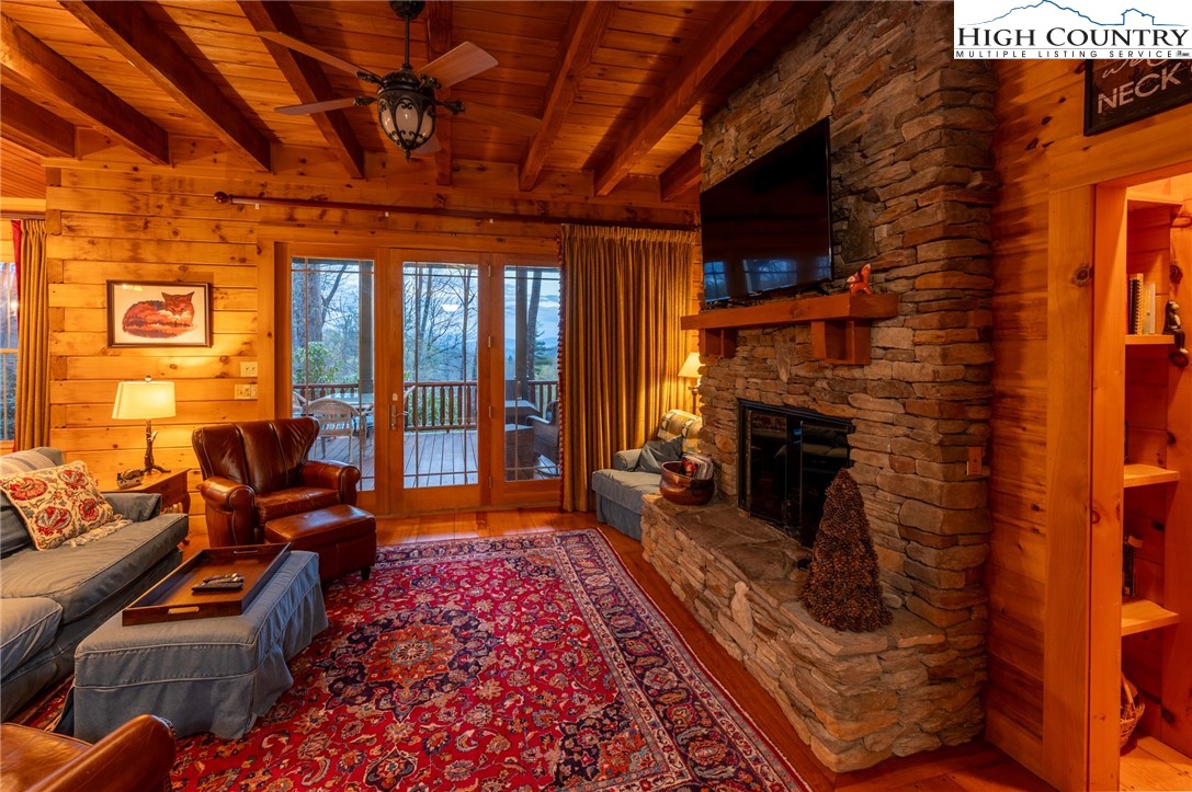 725 Fox Den Road Blowing Rock, NC 28605 - Photo 7 of 44 a living room with furniture and a fireplace
