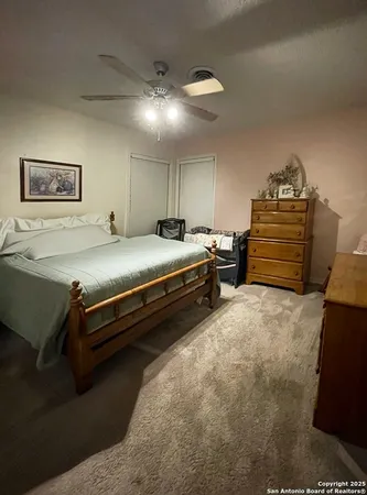 a bed room with a bed and furniture