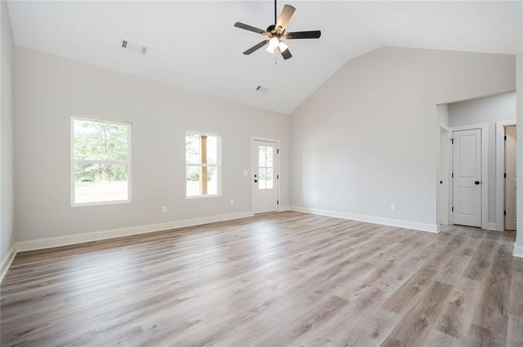 301 C W Sims Road Hiram, GA 30141 - Photo 13 of 29 wooden floor in an empty room with a window