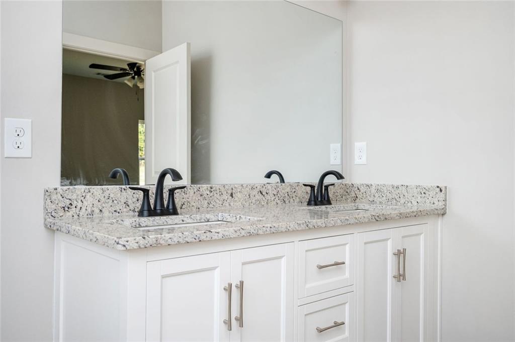 301 C W Sims Road Hiram, GA 30141 - Photo 19 of 29 a bathroom with a granite countertop sink and a mirror