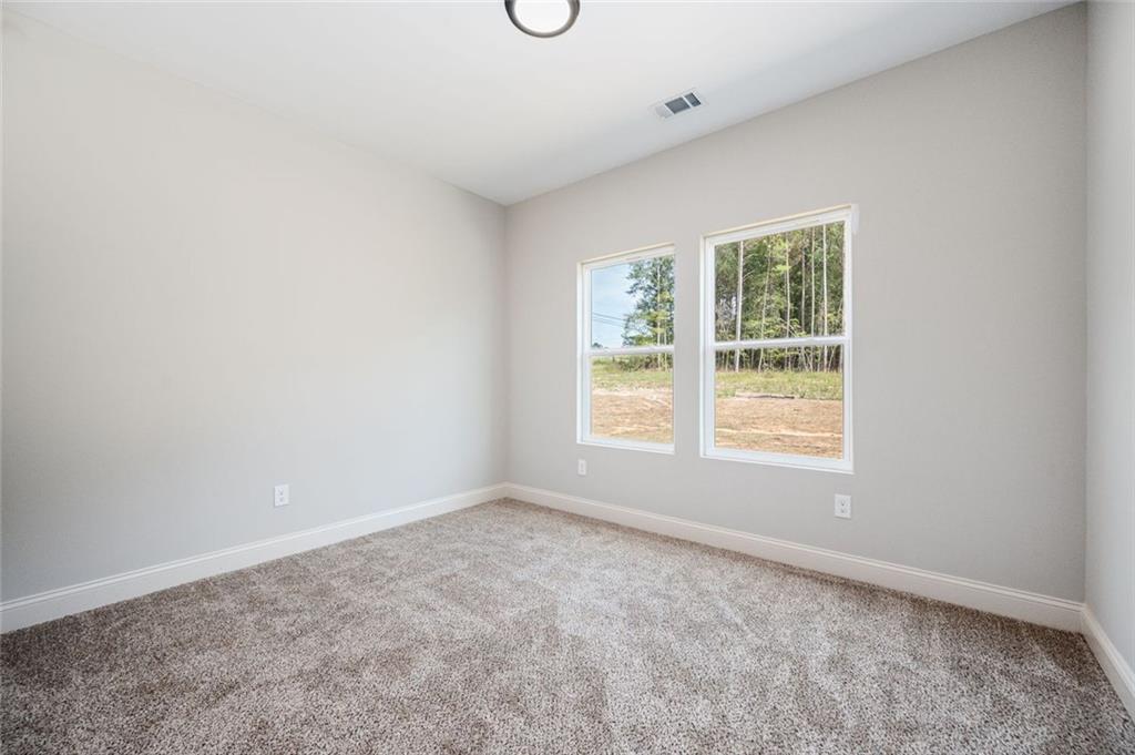 301 C W Sims Road Hiram, GA 30141 - Photo 22 of 29 an empty room with a window
