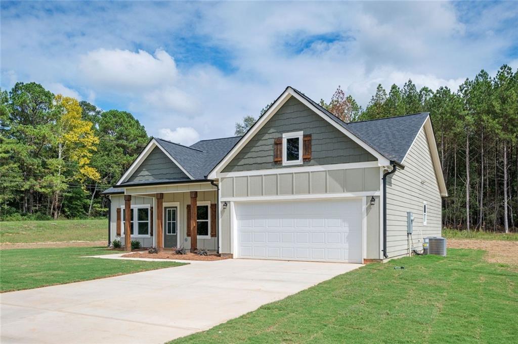 301 C W Sims Road Hiram, GA 30141 - Photo 26 of 29 a front view of a house with a yard