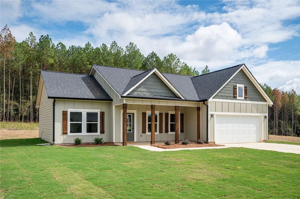 301 C W Sims Road Hiram, GA 30141 - Photo 4 of 29 a view of a house with a yard and front view of a house