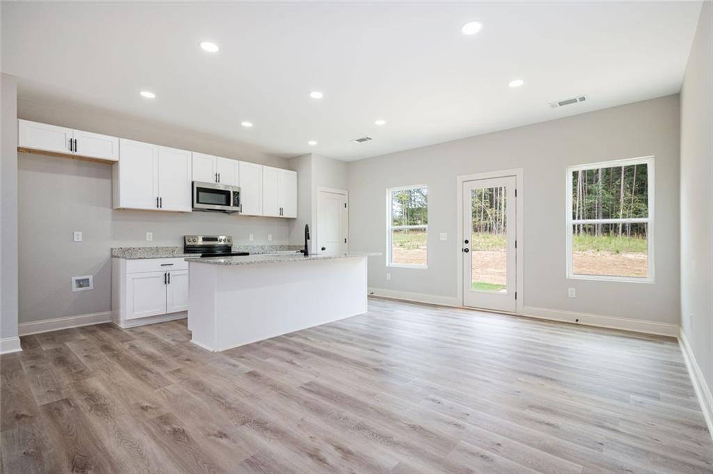 301 C W Sims Road Hiram, GA 30141 - Photo 6 of 29 a view of kitchen with sink and wooden floor