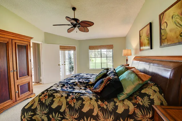 a bathroom with a tub shower and sink