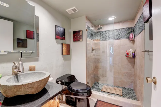 a view of a room with furniture and a window