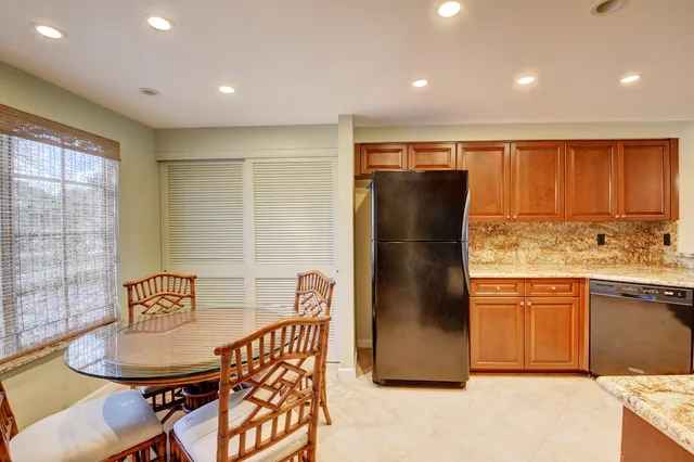 a kitchen with a sink stove top oven and cabinets