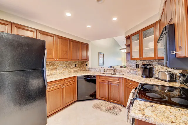 a view of a dining room and livingroom with furniture window and wooden floor
