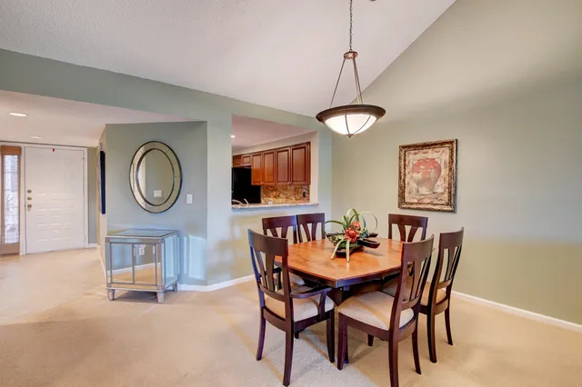 a living room with furniture a window and flat screen tv