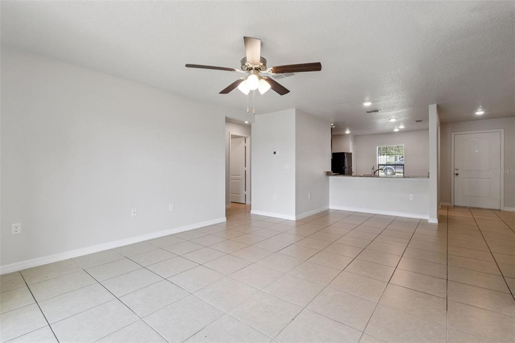 1613 Orne Street Mascotte, FL 34753 - Photo 13 of 31 a view of an empty room and kitchen view