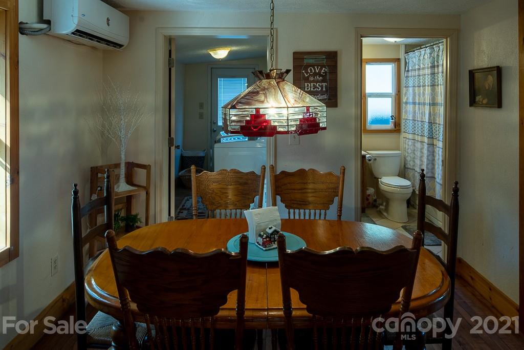 1321 Orchard Road Deep Gap, NC 28618 - Photo 11 of 40 a dining room with furniture and wooden floor