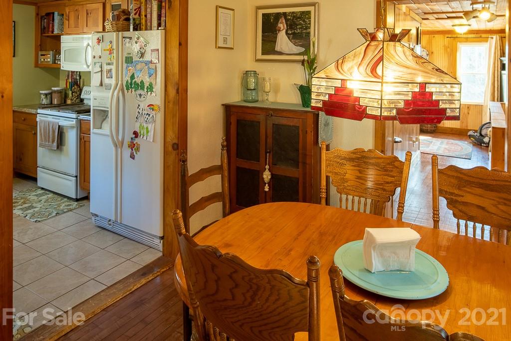 1321 Orchard Road Deep Gap, NC 28618 - Photo 12 of 40 a kitchen that has a table and chairs in it