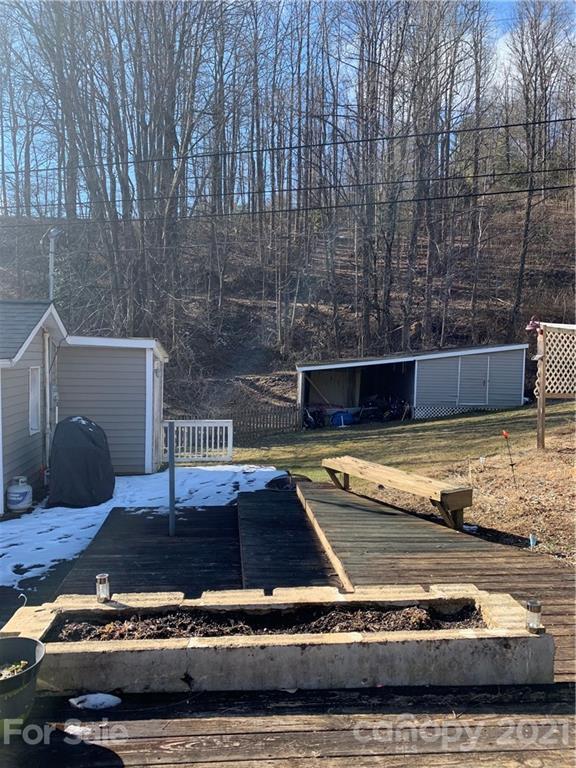 1321 Orchard Road Deep Gap, NC 28618 - Photo 16 of 40 a view of a swimming pool with a yard