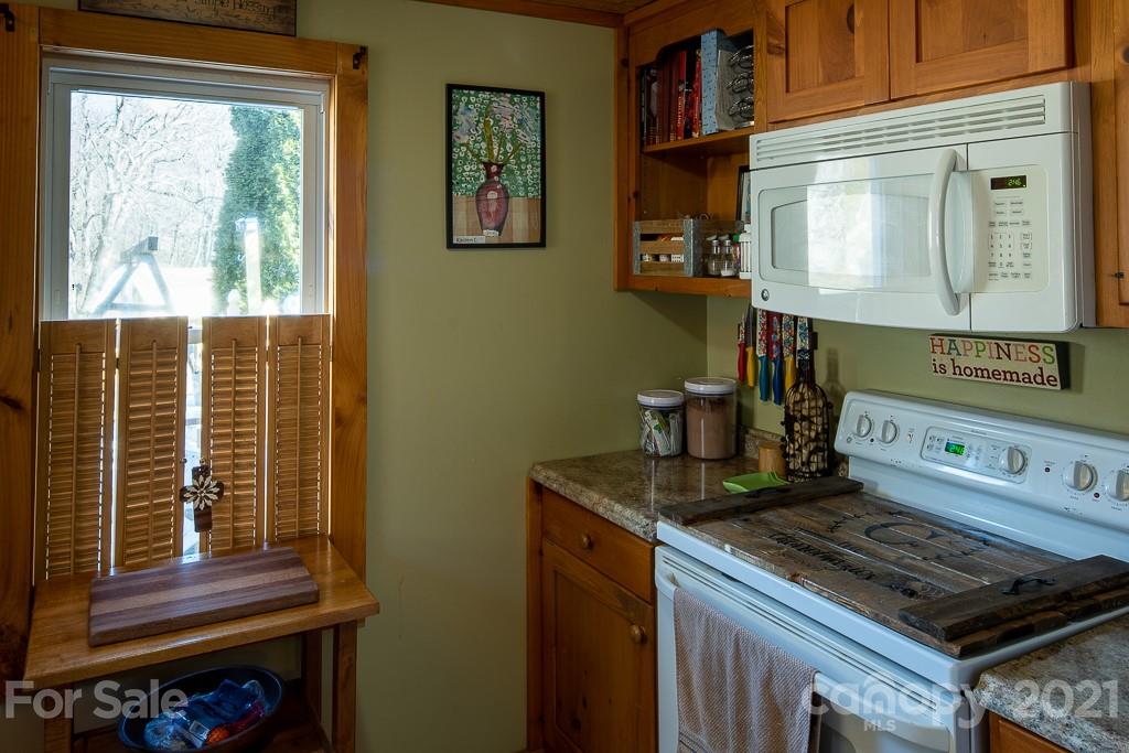 1321 Orchard Road Deep Gap, NC 28618 - Photo 19 of 40 a kitchen with stove and cabinets