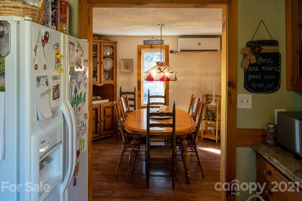 1321 Orchard Road Deep Gap, NC 28618 - Photo 20 of 40 a dining room with furniture and wooden floor