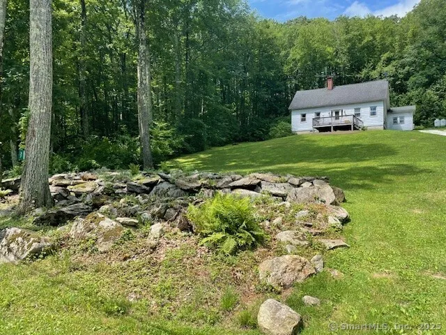 a backyard of a house with lots of green space