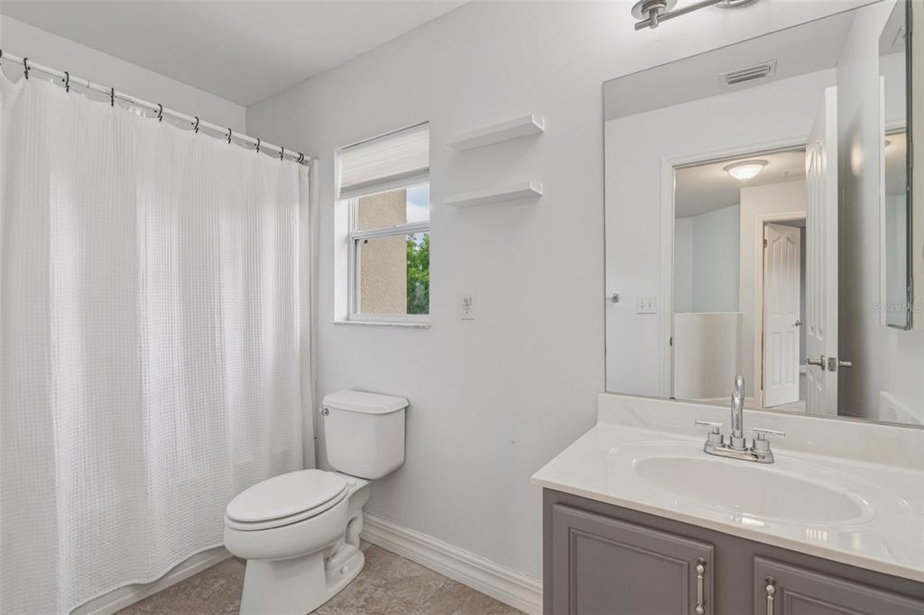 25134 Palisade Road Punta Gorda, FL 33983 - Photo 36 of 58 a bathroom with a sink a toilet and shower