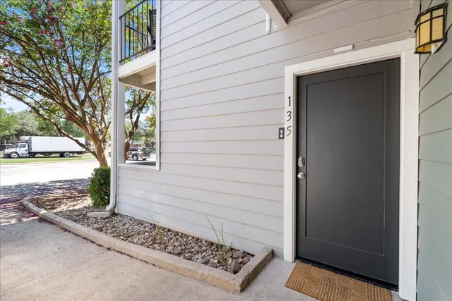 a view of a door and a window