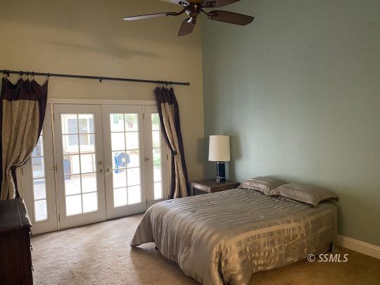 1006 North Sierra View Street Ridgecrest, CA 93555 - Photo 27 of 36 a bedroom with a bed and a window