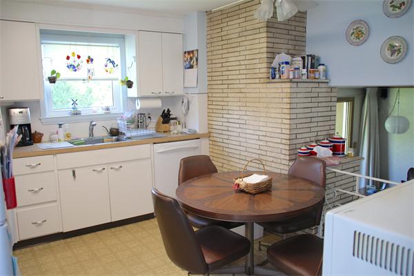 3 Buchanan Road Marblehead, MA 01945 - Photo 9 of 22 a kitchen with stainless steel appliances a sink a table and chairs