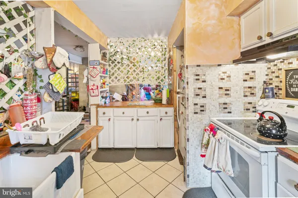 a utility room with sink dryer and washer