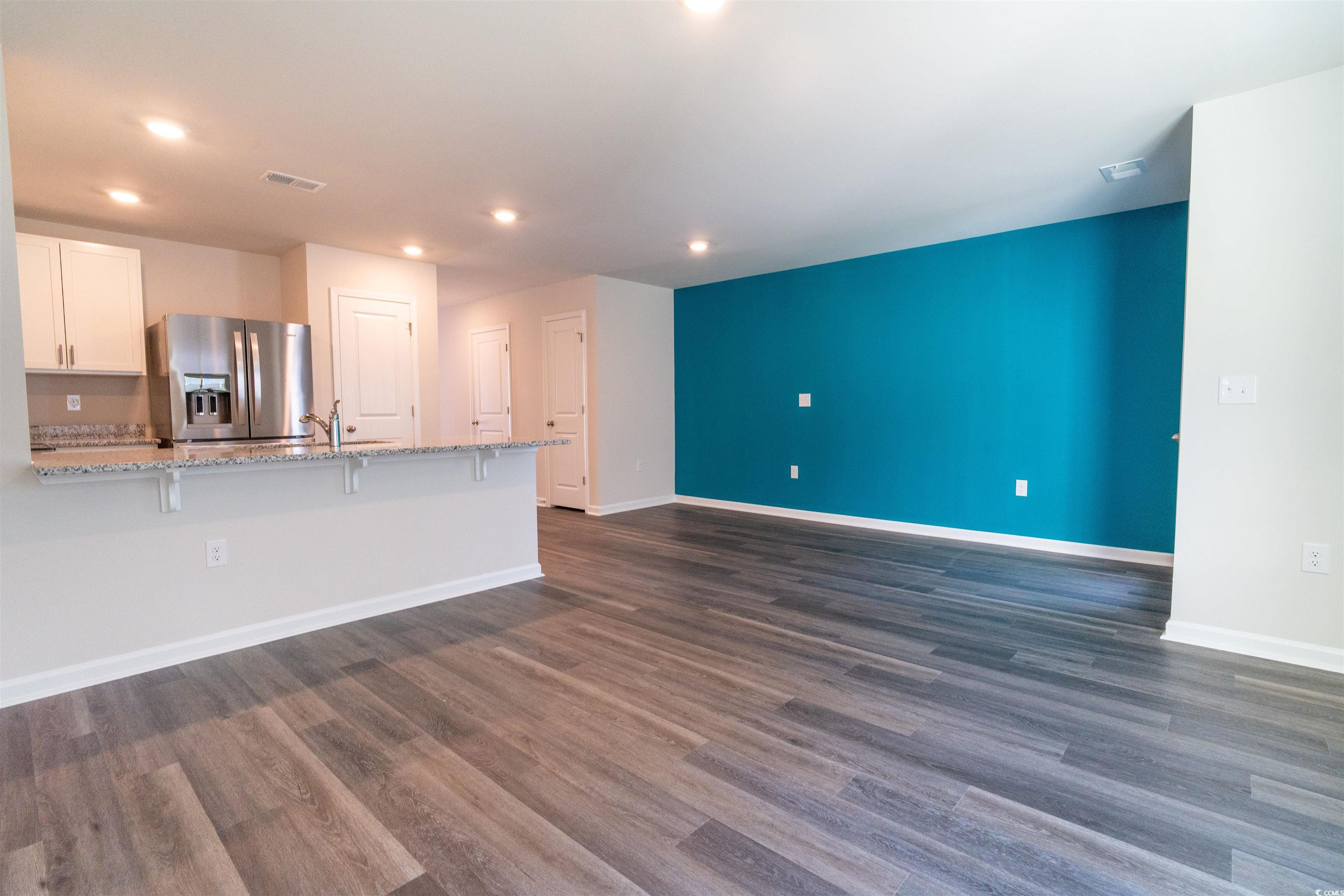 160 Harvest Gold Drive Conway, SC 29526 - Photo 11 of 37 Unfurnished living room featuring dark wood-type flooring and recessed lighting