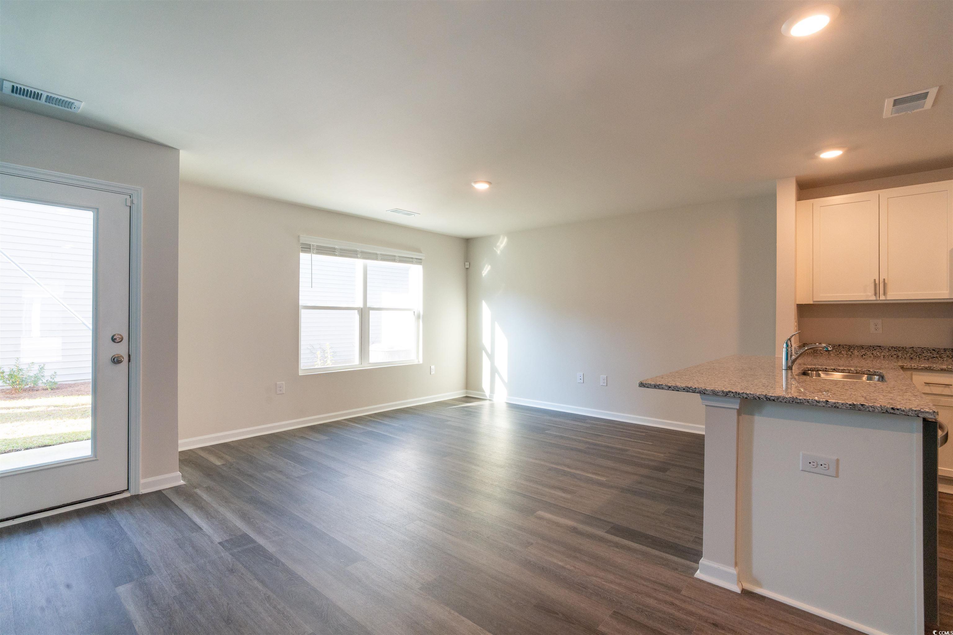 160 Harvest Gold Drive Conway, SC 29526 - Photo 15 of 37 Unfurnished living room featuring dark wood finished floors and recessed lighting