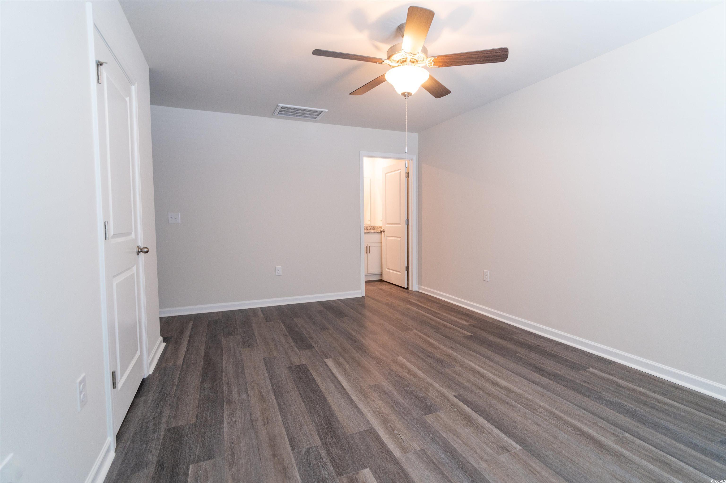 160 Harvest Gold Drive Conway, SC 29526 - Photo 21 of 37 Unfurnished room with dark wood-style floors and a ceiling fan