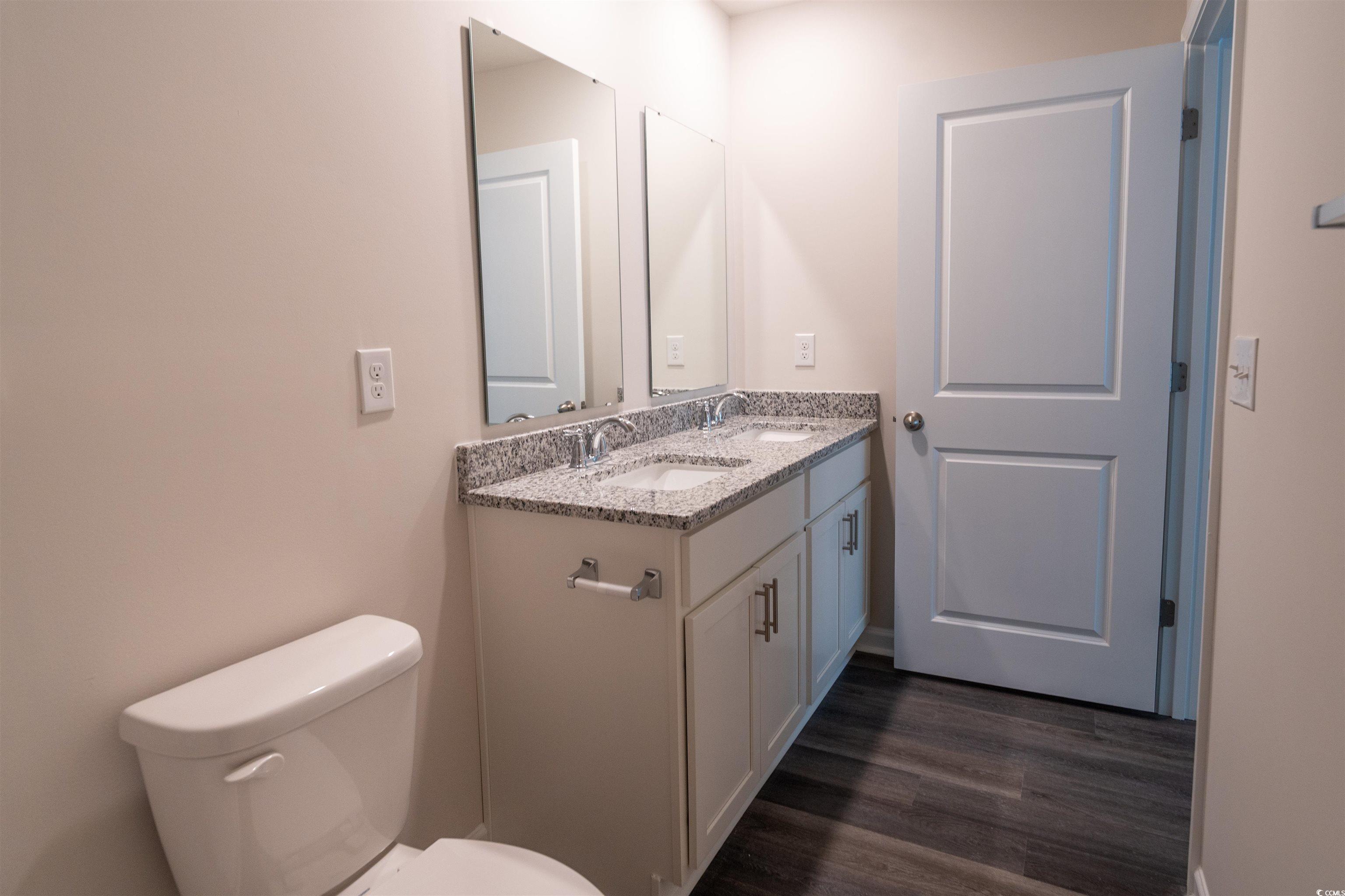 160 Harvest Gold Drive Conway, SC 29526 - Photo 24 of 37 Bathroom featuring double vanity and dark wood-style flooring